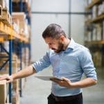 man uses business central warehouse management functionality to control stocl business central warehouse management can simplify stock control