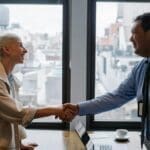 Improved customer relationships Business partners shaking hands