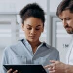Integrations Man and woman looking at ipad