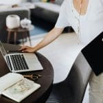 Lady using laptop Akita is a leading provider of dynamics 365 audits