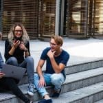 university case study Students sitting on university steps