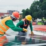 benefits of a field service CRM Field technicians installing solar panel